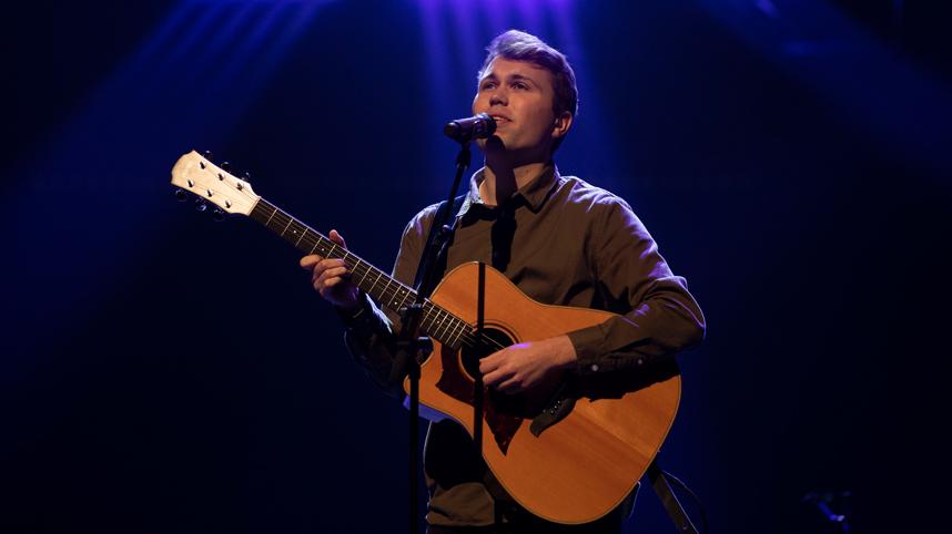 Ben Knudson leads worship during a chapel service in October 2019.